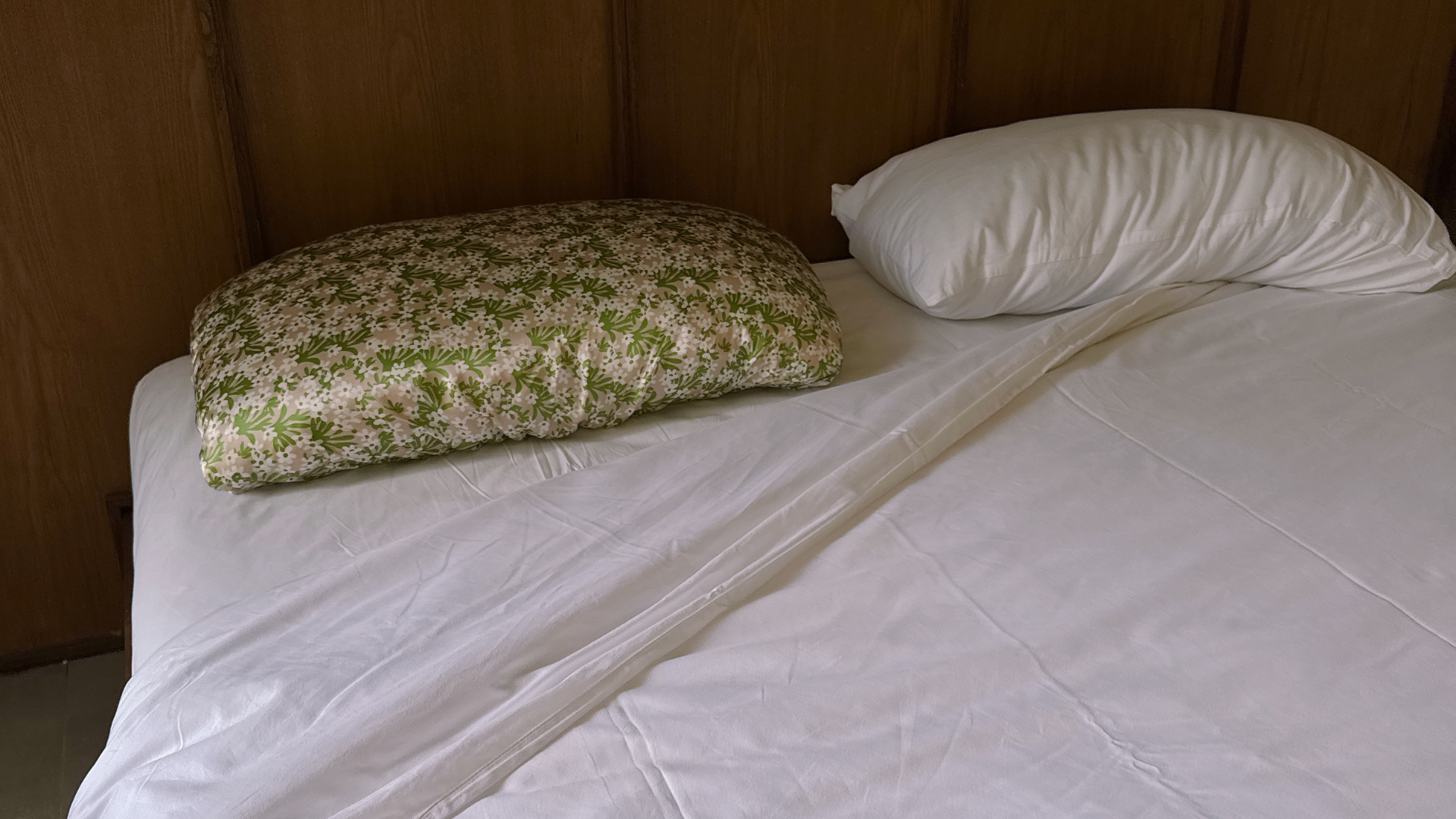 LATRAVLA Flor PillowWrap on an airbnb bed in Bali.