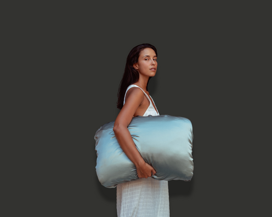 Model holding the NOMAD PillowWrap