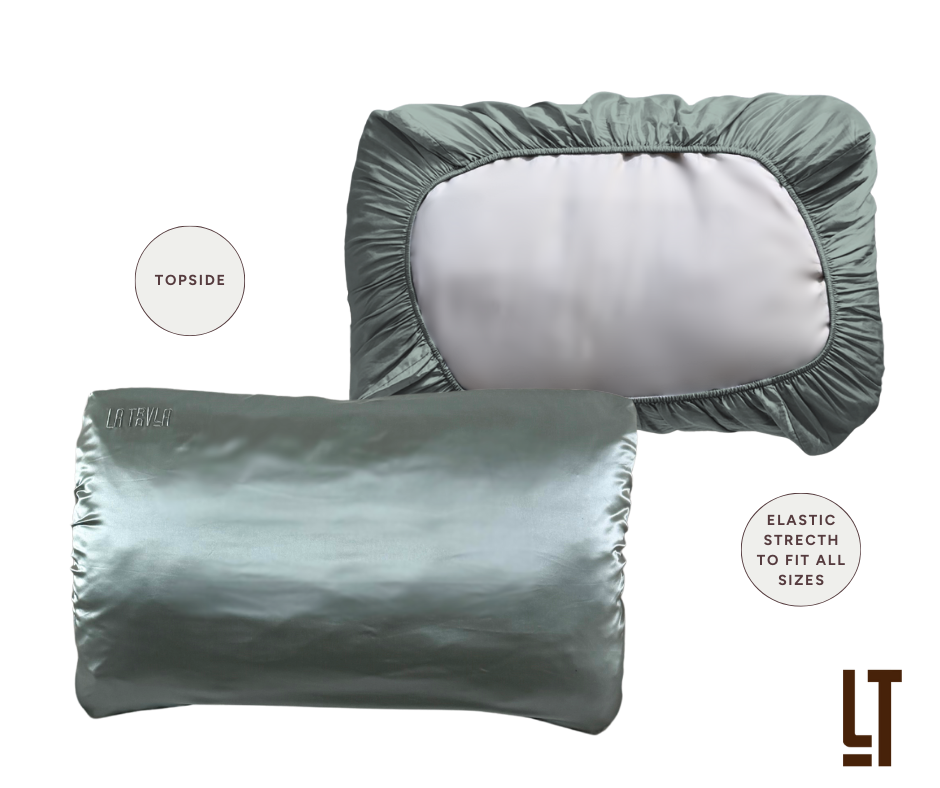 Two nomad silk pillowcases with elastic stretch on a white background.